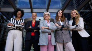 A group of women standing posing